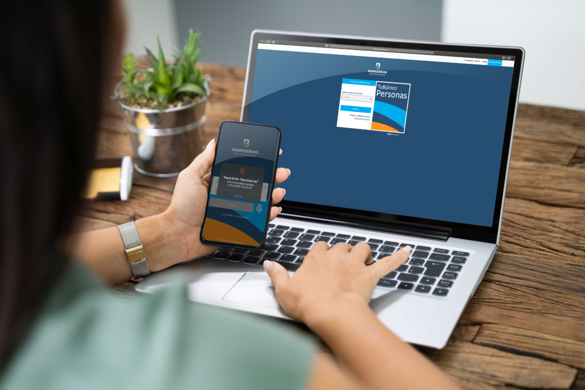 Woman Using Mobile Phone App To Authenthificate Bank Transfer