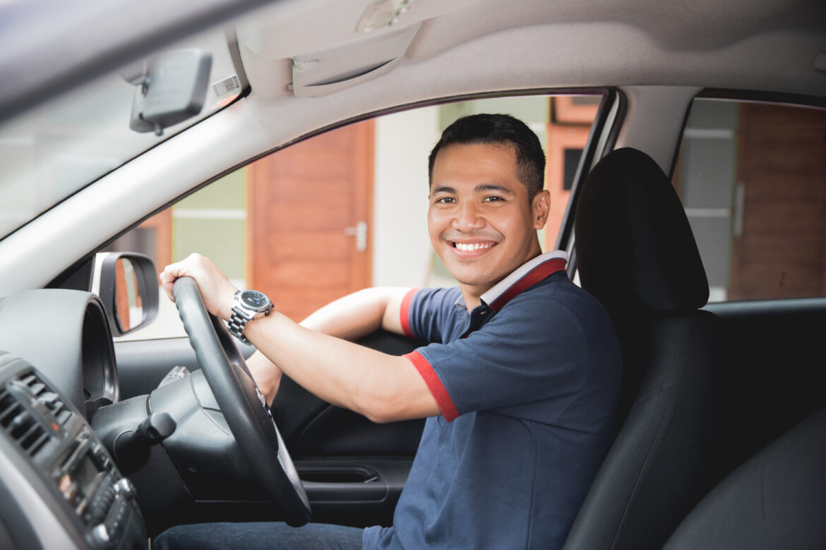 Happy,Young,Asian,Driver,Smiling,To,Camera