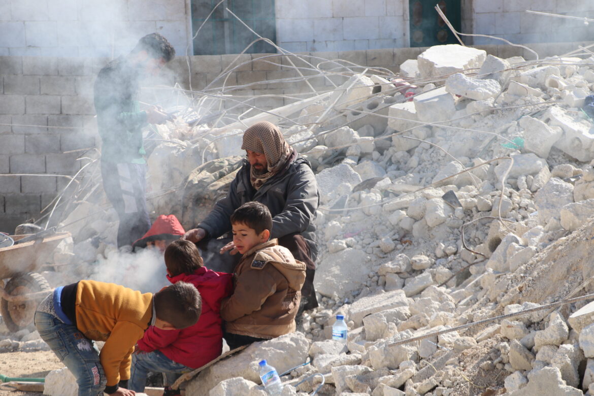The rubble and fires to warm children